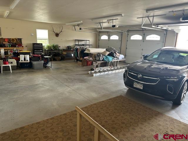 1941 Kaleigh Circle Cortez, CO 81321 - Photo 34 of 35 a living room with lots of furniture and a chandelier