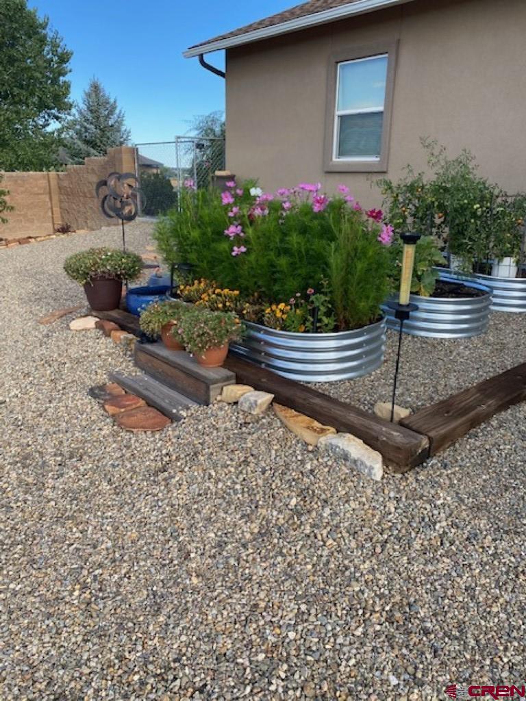 1941 Kaleigh Circle Cortez, CO 81321 - Photo 6 of 35 a front view of a house with garden