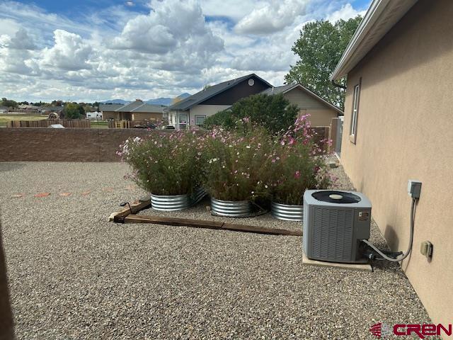 1941 Kaleigh Circle Cortez, CO 81321 - Photo 8 of 35 a view of a porch with furniture and floor to ceiling window