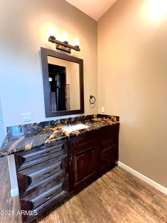 a room with a bed and a mirror