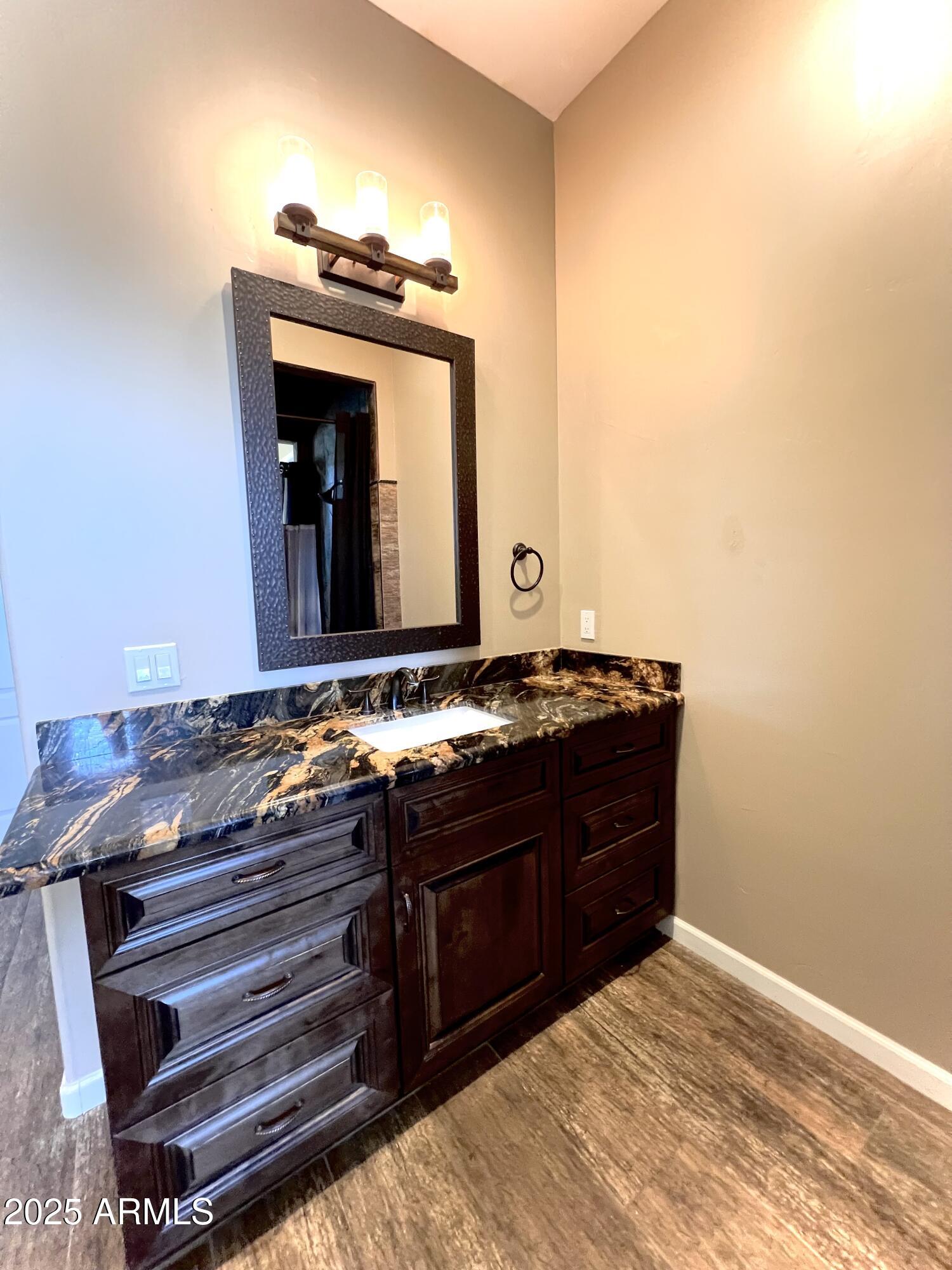 15035 East Countryside Road Mayer, AZ 86333 - Photo 12 of 37 a room with a bed and a mirror