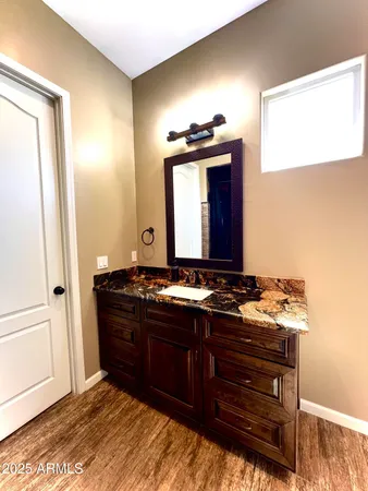a room with a bed and a mirror