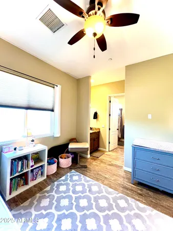 a living room with stainless steel appliances kitchen island granite countertop furniture and a large window
