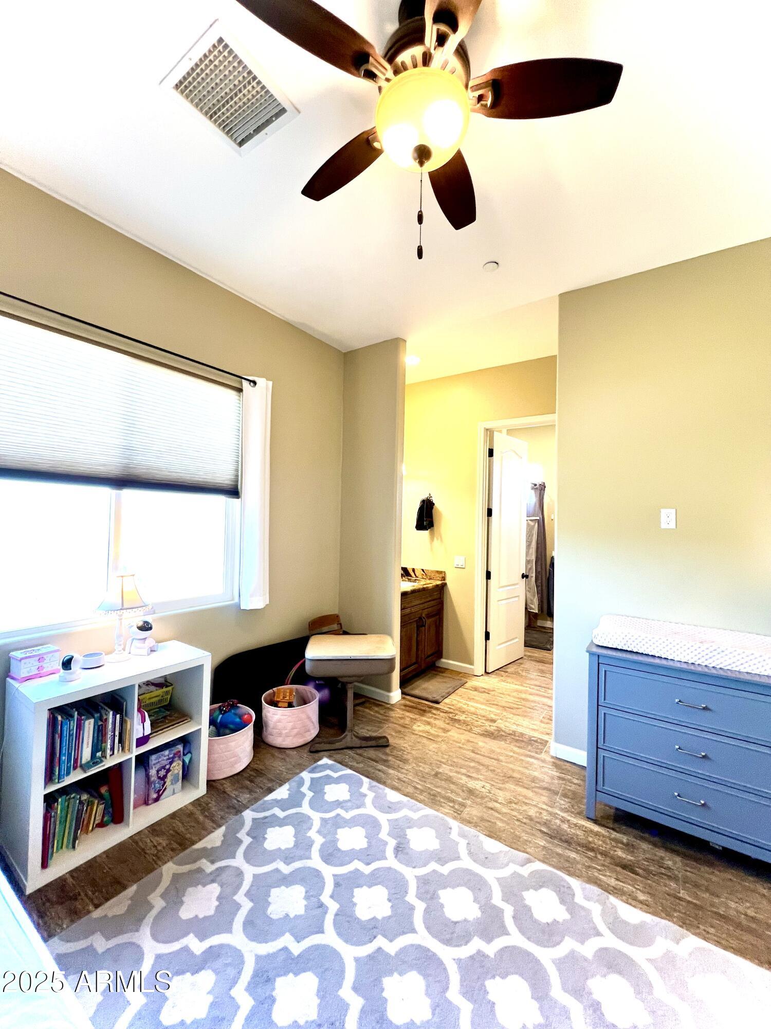 15035 East Countryside Road Mayer, AZ 86333 - Photo 24 of 37 a living room with stainless steel appliances kitchen island granite countertop furniture and a large window