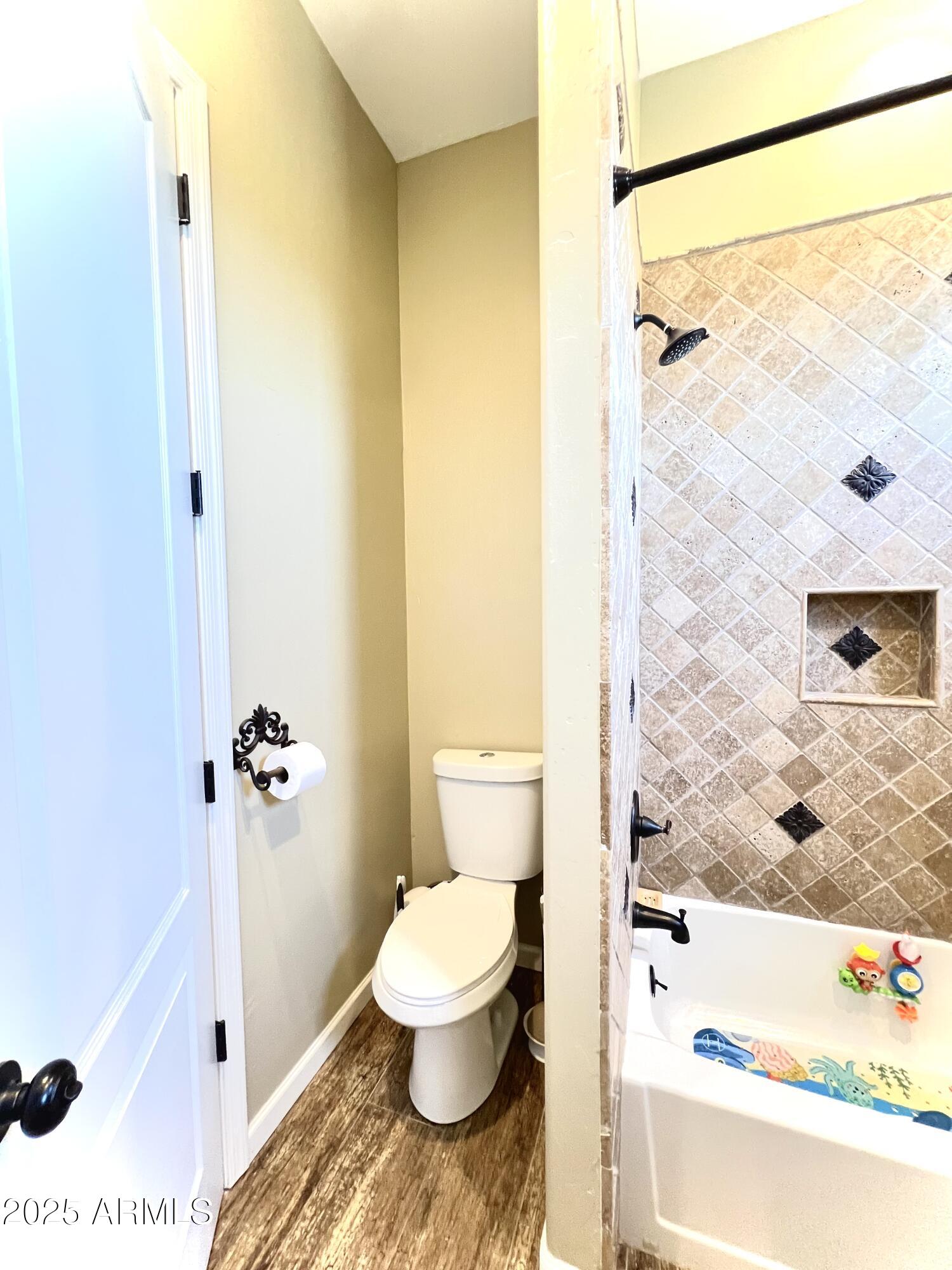 15035 East Countryside Road Mayer, AZ 86333 - Photo 28 of 37 a bathroom with a toilet and a shower