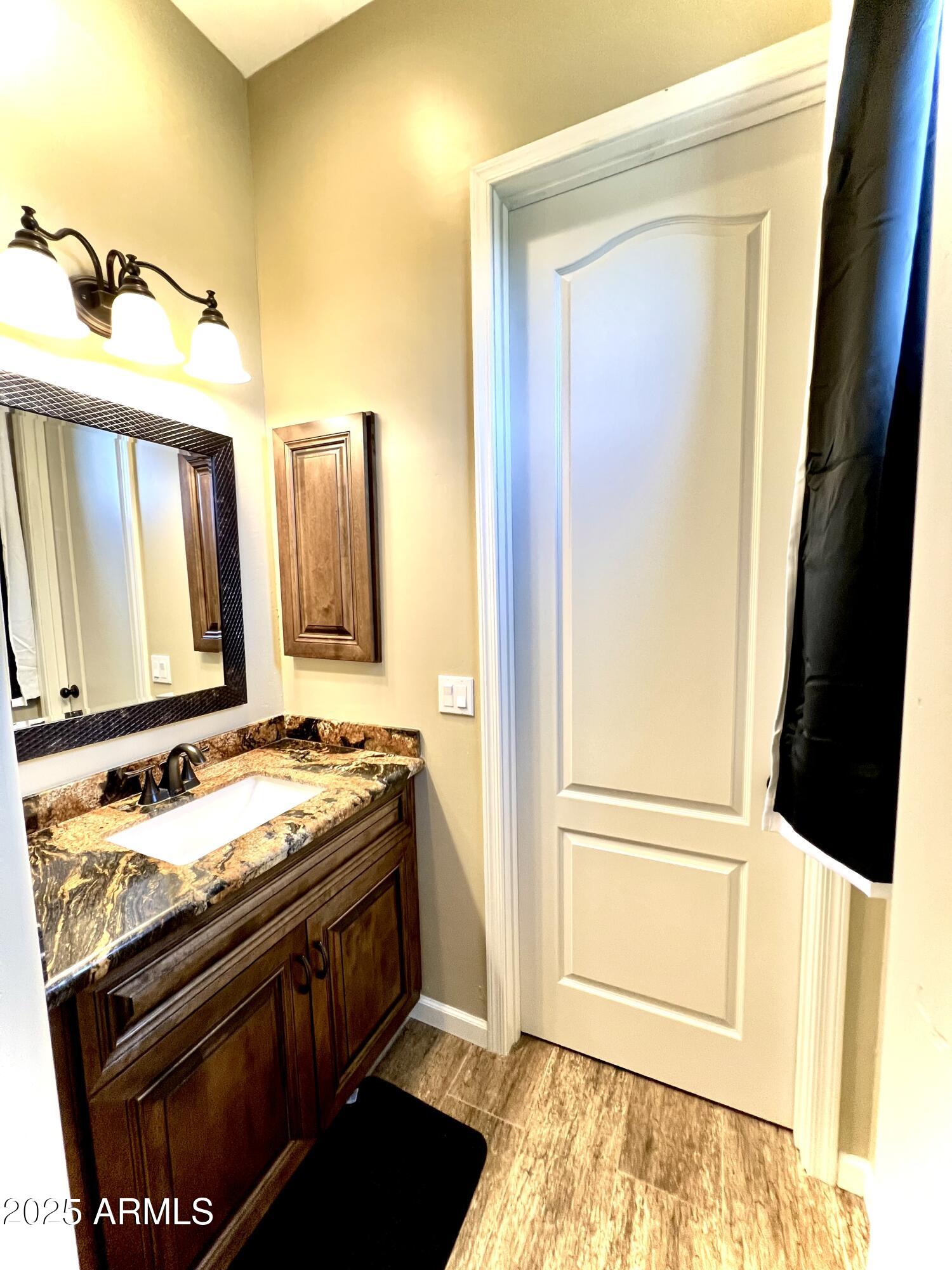 15035 East Countryside Road Mayer, AZ 86333 - Photo 29 of 37 a bathroom with a sink and a mirror