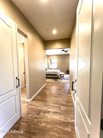 a view of a kitchen from a hallway