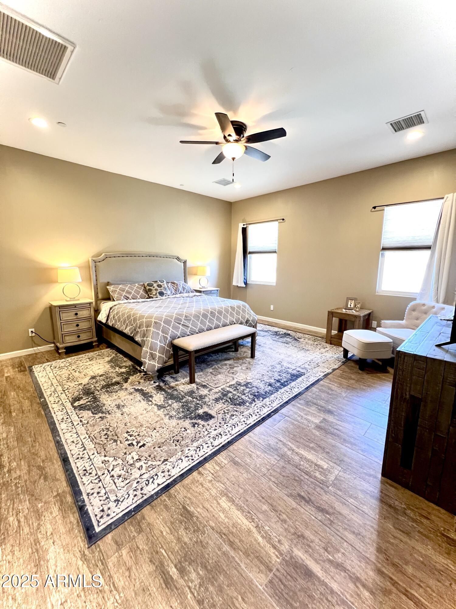 15035 East Countryside Road Mayer, AZ 86333 - Photo 9 of 37 a bed room with a bed window and a couch