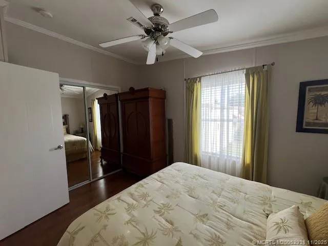 a bedroom with a bed and a chair