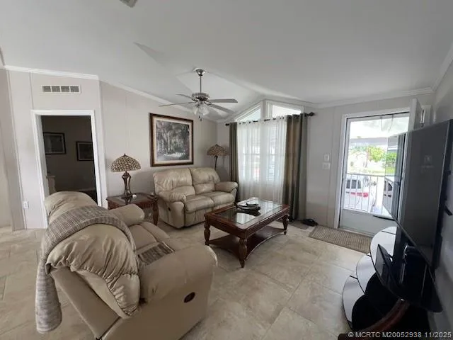 a bed room with two bed and a flat screen tv