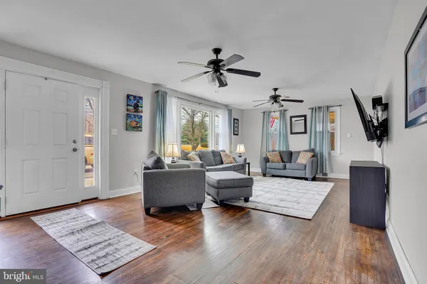a living room with furniture and a rug