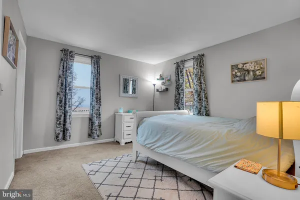 a bedroom with a bed and a table in it