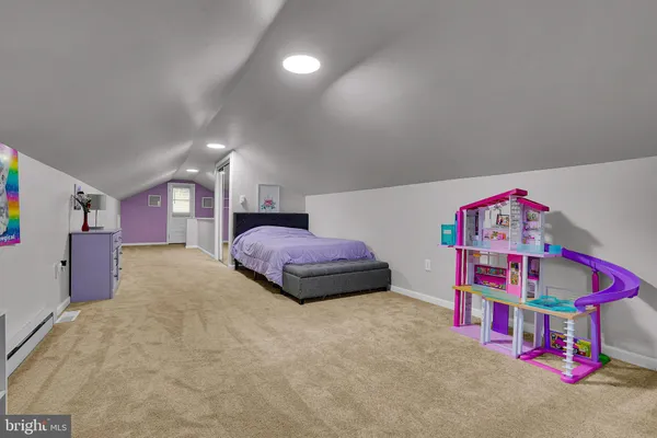 a bedroom with furniture and a couch