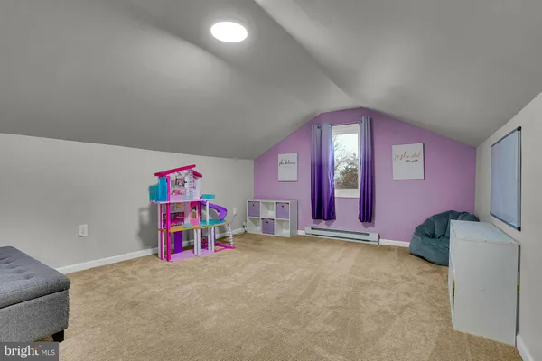 a bedroom with furniture and chandelier