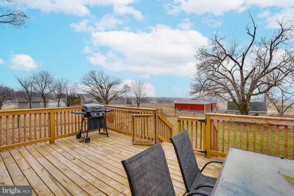 a view of a house with a yard and garage