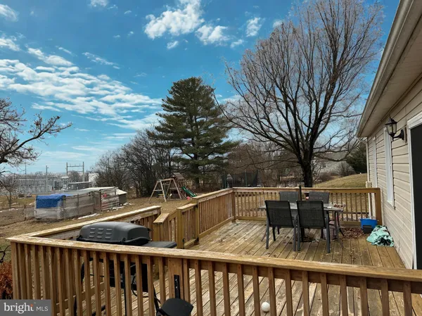 a view of a patio with table and chairs