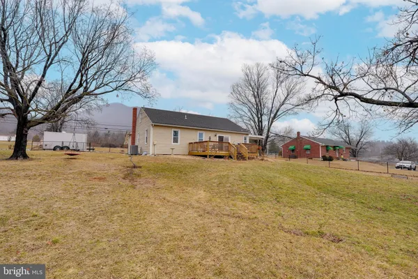 a view of a yard with a house and trees