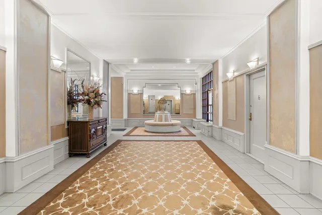 a large white room with wooden floor