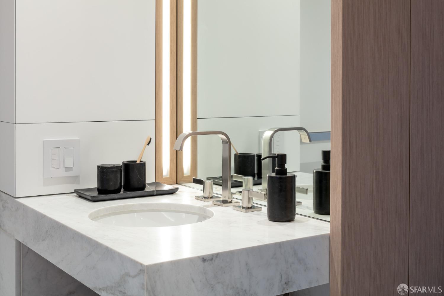 1 Steuart Street, Unit 906 San Francisco, CA 94105 - Photo 16 of 38 a kitchen with a refrigerator and a sink