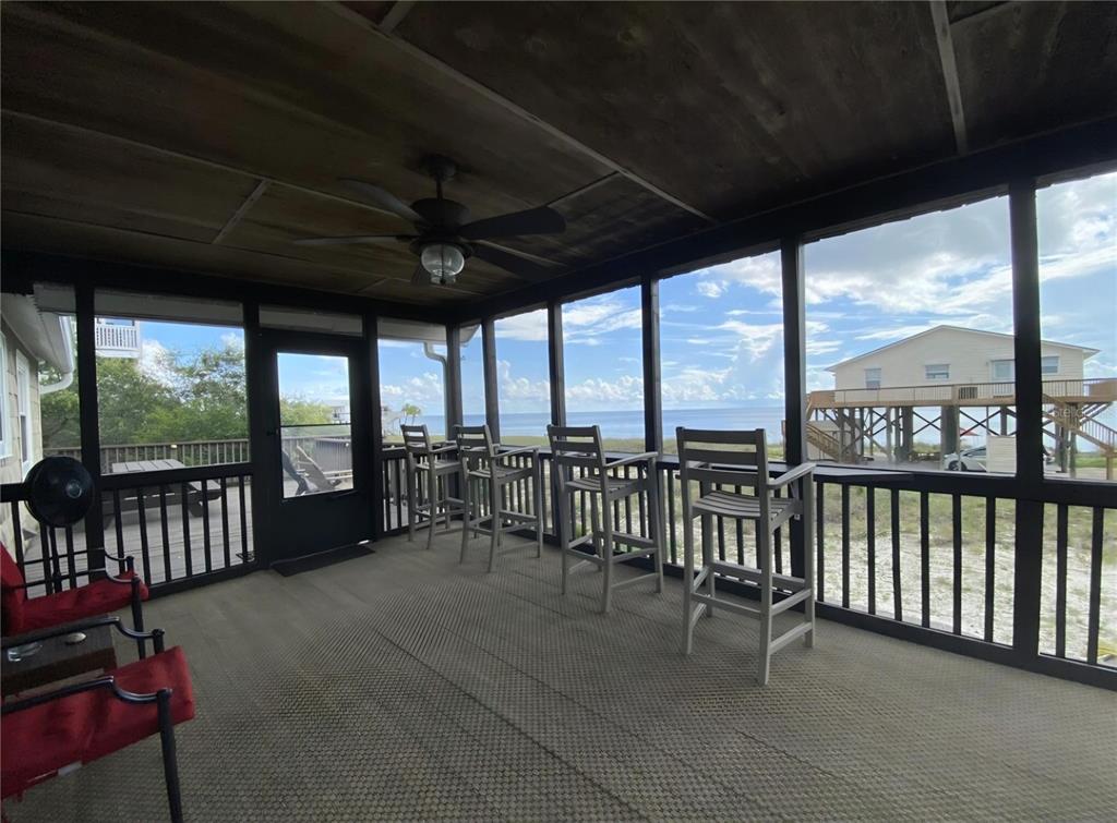 7 Bass Street Panacea, FL 32346 - Photo 11 of 11 a view of a balcony with furniture
