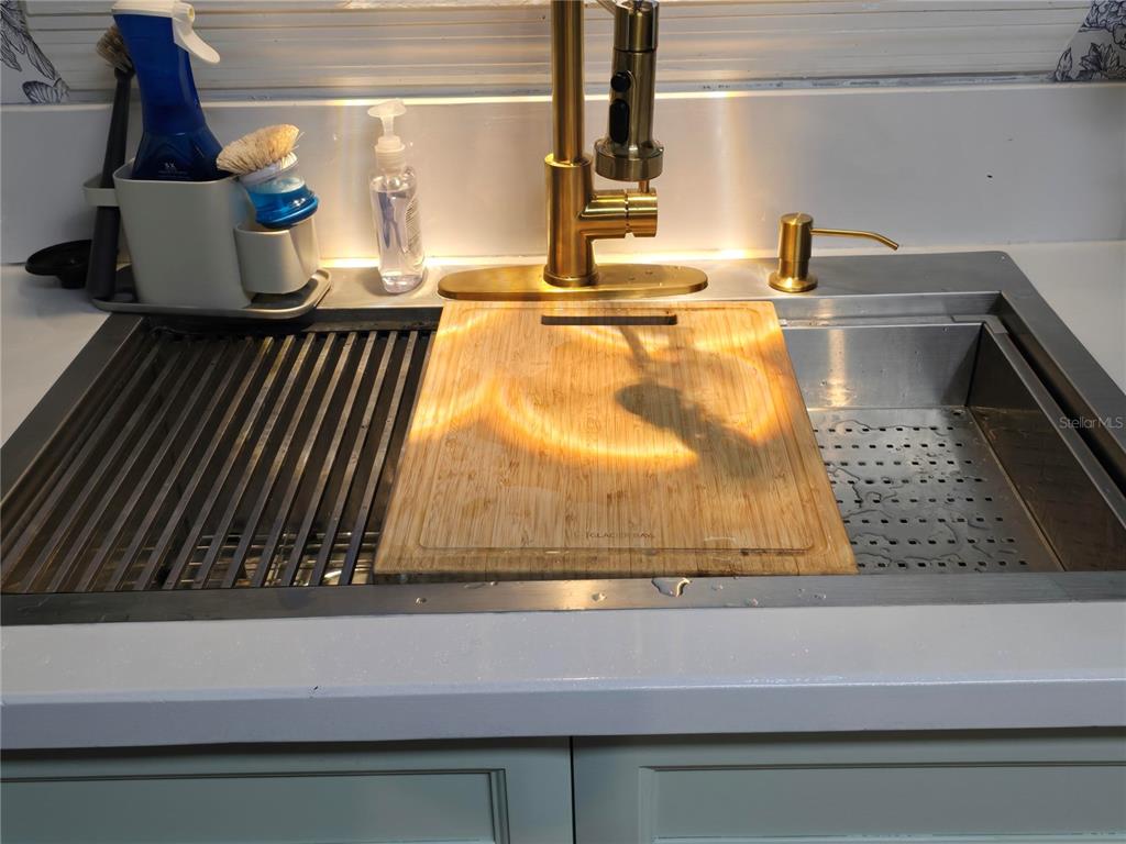 7 Bass Street Panacea, FL 32346 - Photo 4 of 11 a view of living room with a fireplace