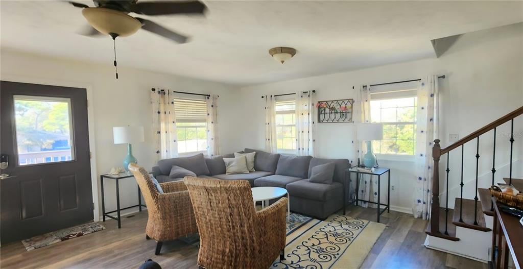 7 Bass Street Panacea, FL 32346 - Photo 5 of 11 a living room with furniture and wooden floor