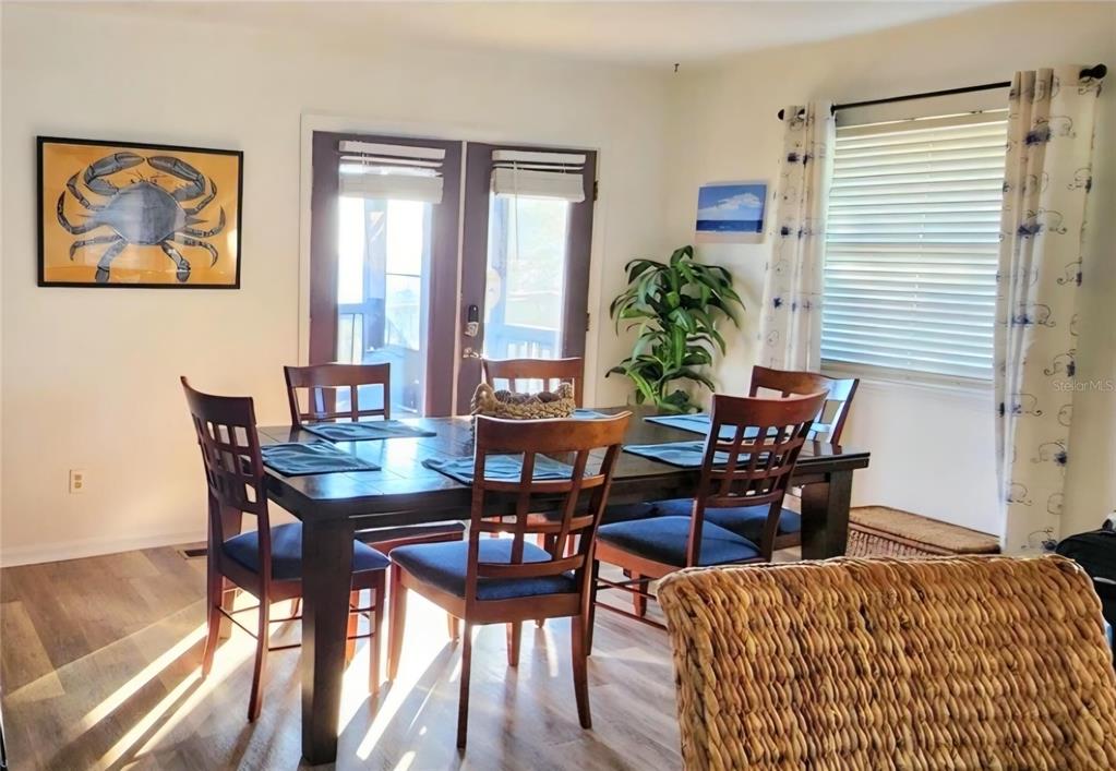 7 Bass Street Panacea, FL 32346 - Photo 6 of 11 a view of a dining room with furniture and a potted plant