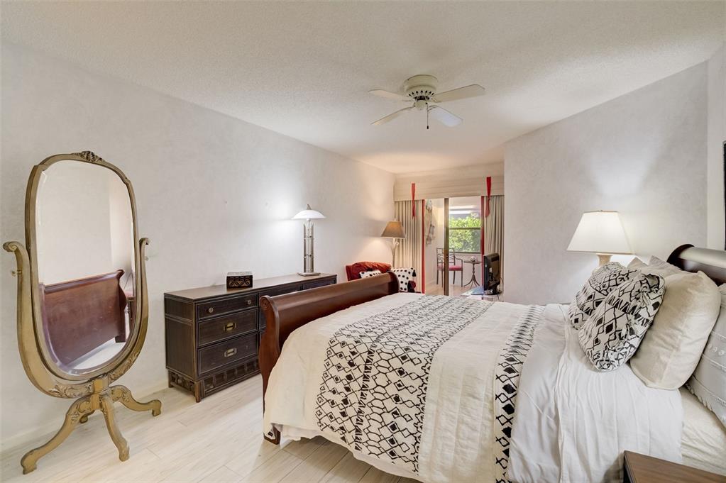 5051 Pine Drive Boynton Beach, FL 33437 - Photo 21 of 40 a bedroom with a bed and dresser