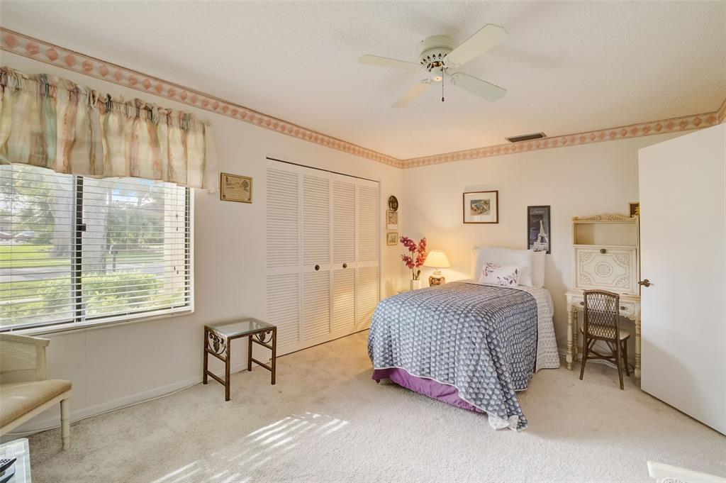 5051 Pine Drive Boynton Beach, FL 33437 - Photo 25 of 40 a bedroom with a bed and a window