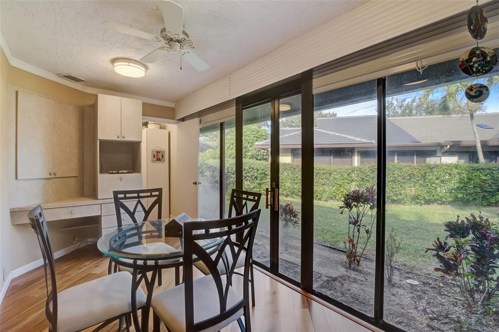 5051 Pine Drive Boynton Beach, FL 33437 - Photo 30 of 40 a view of a dining room with furniture window and outside view