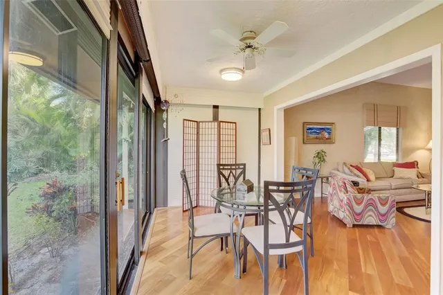 a view of a livingroom with furniture window and wooden floor