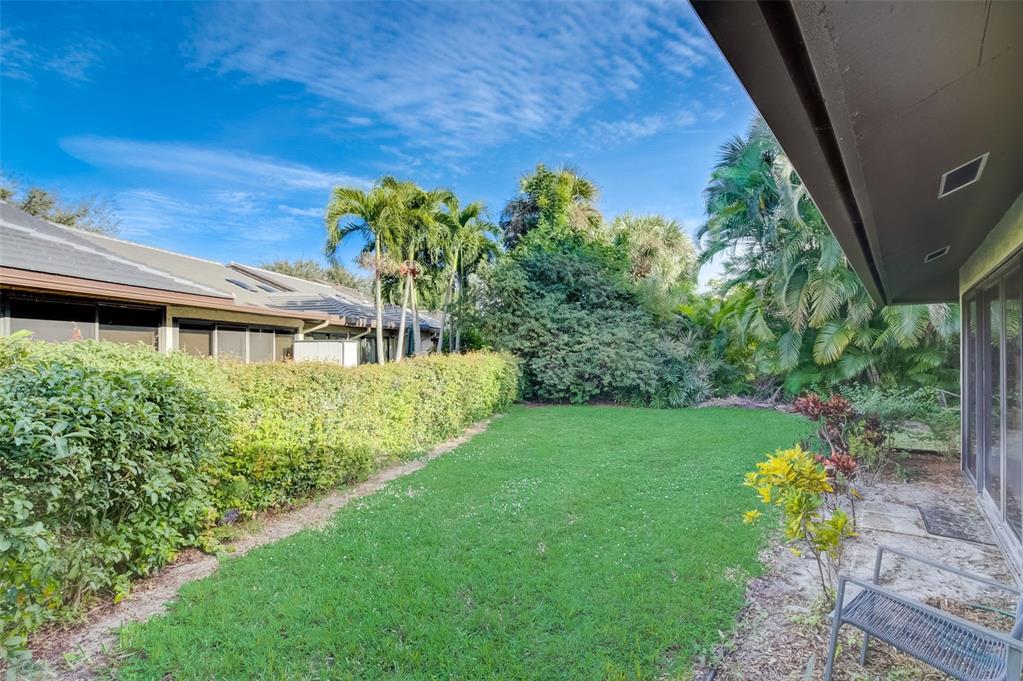 5051 Pine Drive Boynton Beach, FL 33437 - Photo 32 of 40 a garden view with a seating space