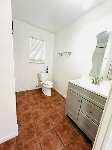 a bathroom with a sink and a toilet