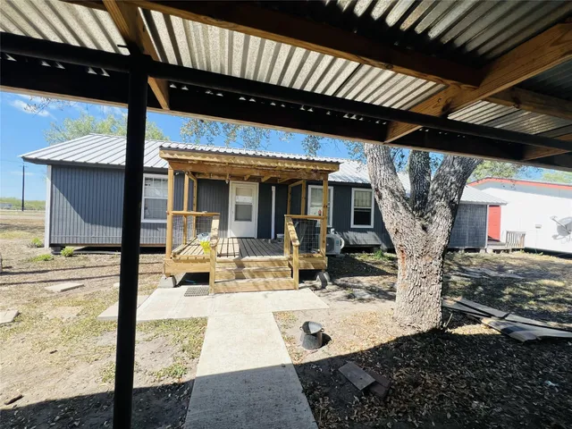 a view of a porch with furniture