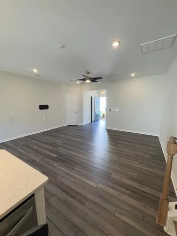 an entryway with wooden floor