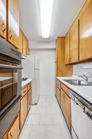 a bedroom with a bed couch and a window