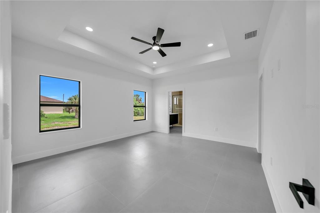 2328 Irondale Road North Port, FL 34287 - Photo 15 of 45 an empty room with windows and closet