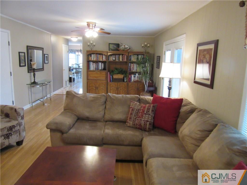 63 Royce Brook Road Hillsborough, NJ 08844 - Photo 11 of 25 a living room with furniture and chandelier