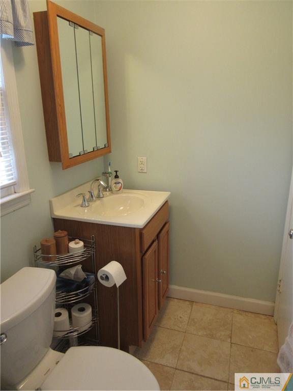 63 Royce Brook Road Hillsborough, NJ 08844 - Photo 14 of 25 a bathroom with a sink a toilet and mirror