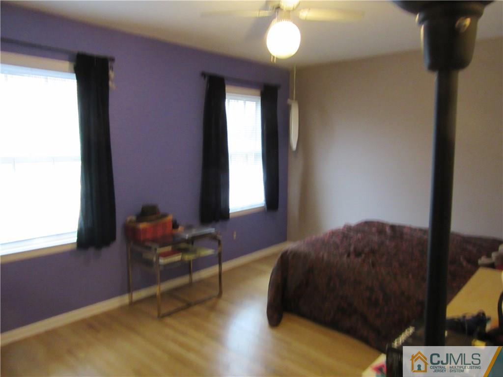 63 Royce Brook Road Hillsborough, NJ 08844 - Photo 16 of 25 a bedroom with a bed and a window