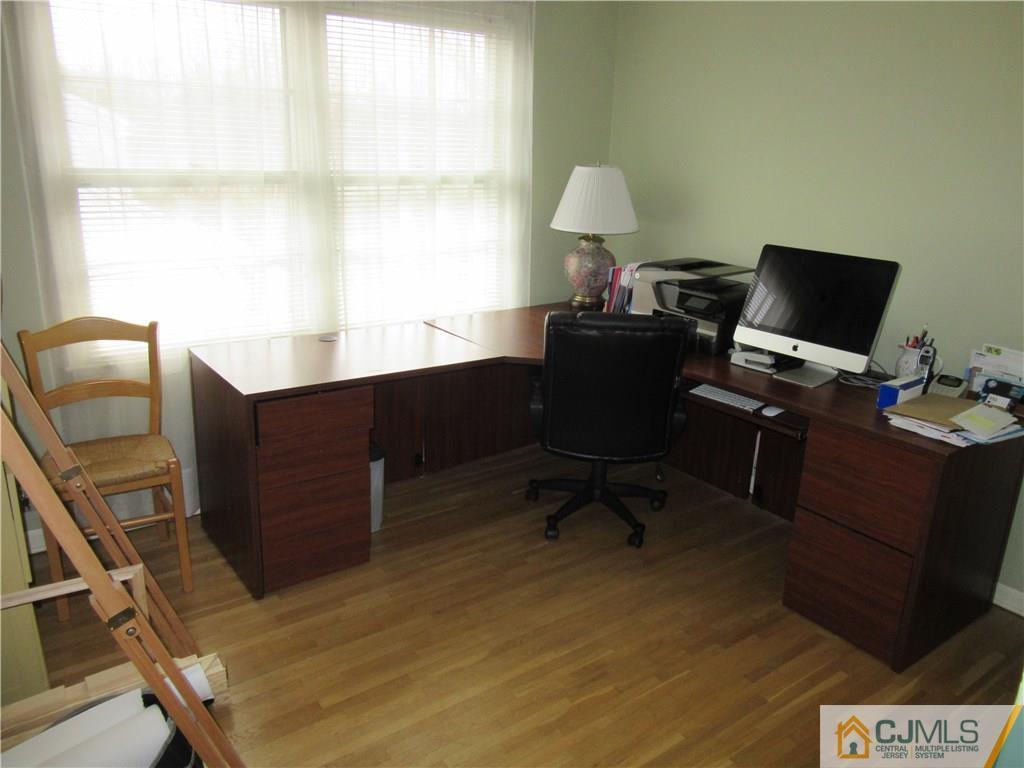 63 Royce Brook Road Hillsborough, NJ 08844 - Photo 17 of 25 a view of a workspace with furniture and a window