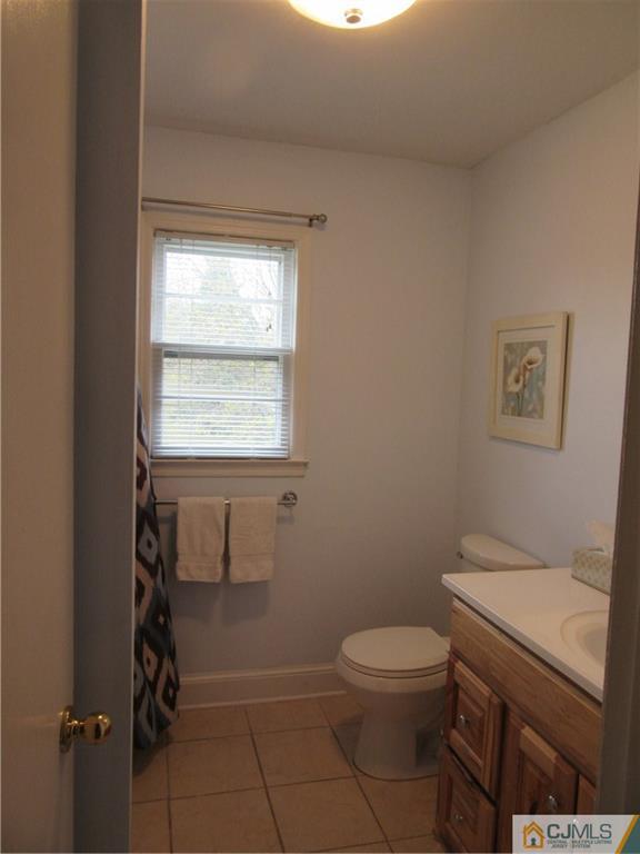 63 Royce Brook Road Hillsborough, NJ 08844 - Photo 18 of 25 a bathroom with a toilet a sink and mirror
