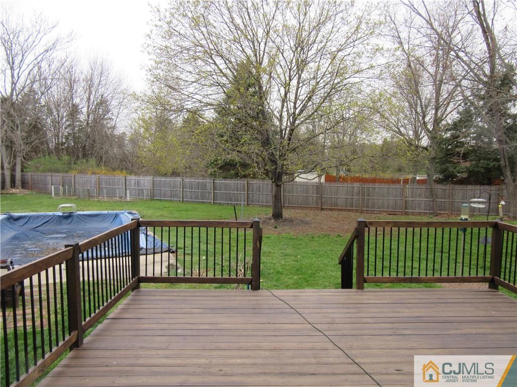 63 Royce Brook Road Hillsborough, NJ 08844 - Photo 21 of 25 a view of a deck with a yard