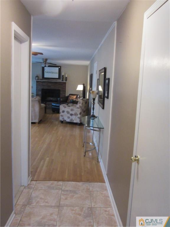 63 Royce Brook Road Hillsborough, NJ 08844 - Photo 24 of 25 a living room with furniture and a flat screen tv