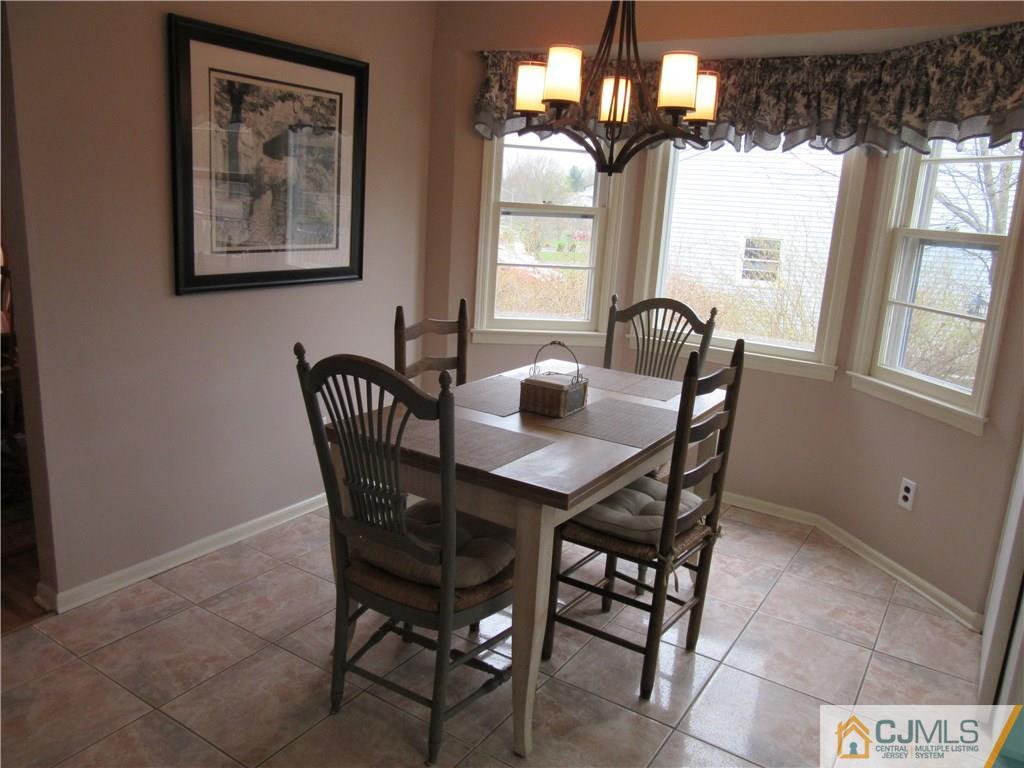 63 Royce Brook Road Hillsborough, NJ 08844 - Photo 6 of 25 a dining room with furniture and window