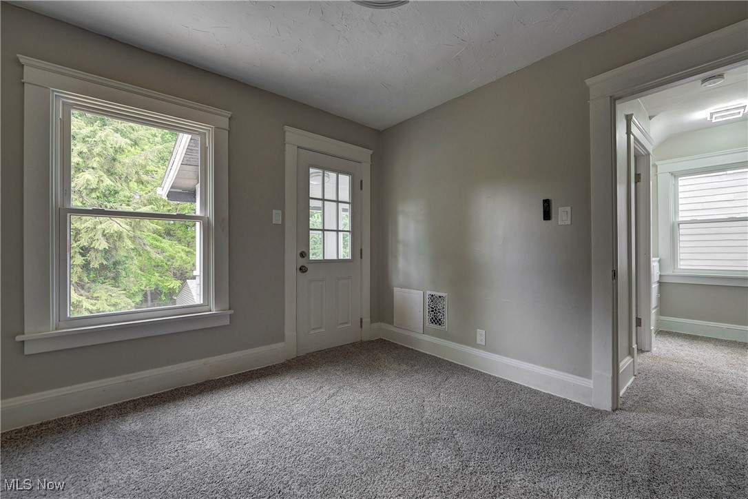896 Selwyn Road Cleveland Heights, OH 44112 - Photo 14 of 23 Doorway to outside featuring carpet