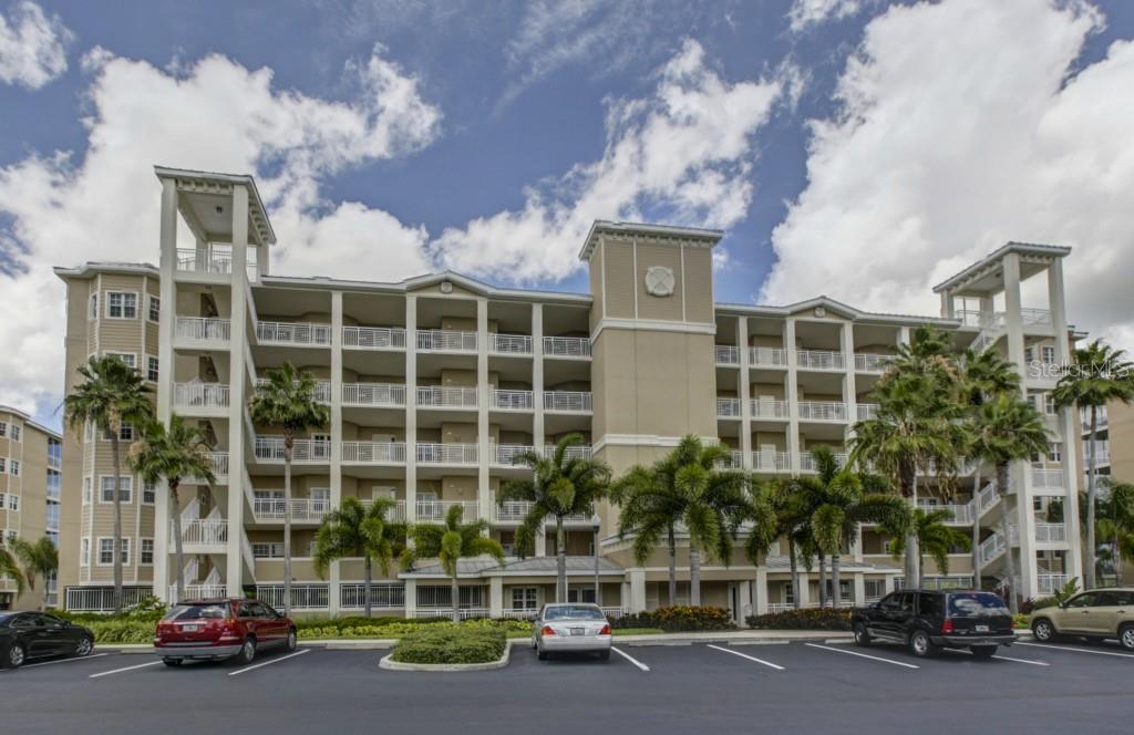 7194 Key Haven Road, Unit 205 Seminole, FL 33777 - Photo 1 of 1 front view of a building with a street