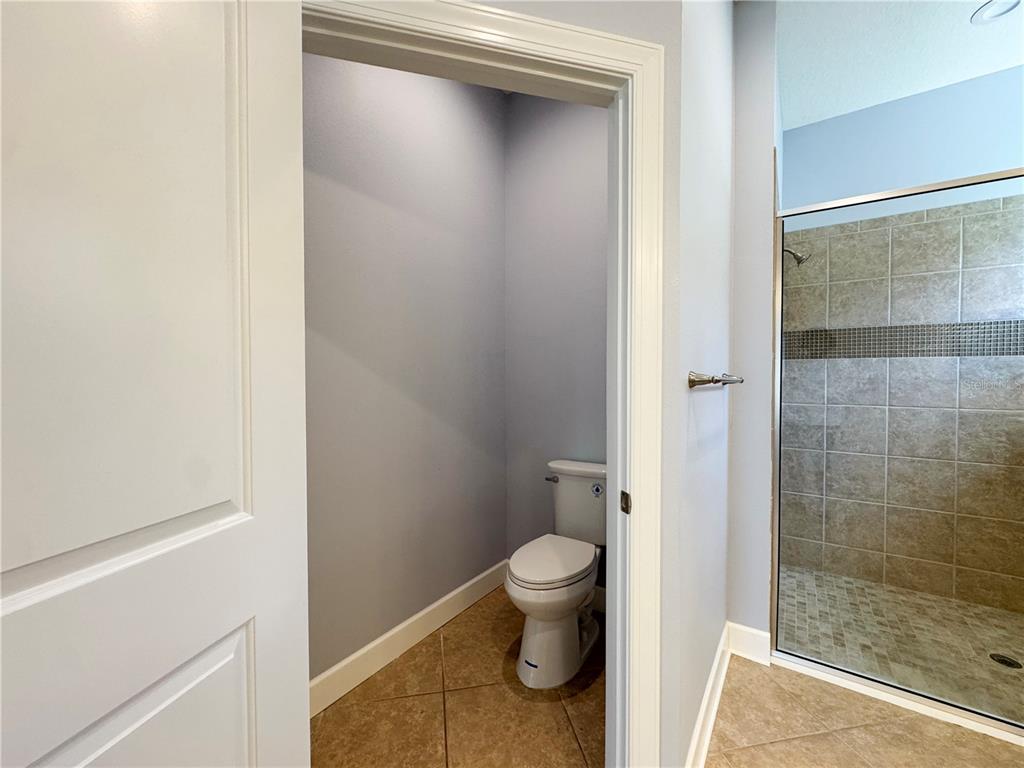 12822 Del Corso Loop Bradenton, FL 34211 - Photo 20 of 58 a bathroom with a granite countertop toilet and a sink
