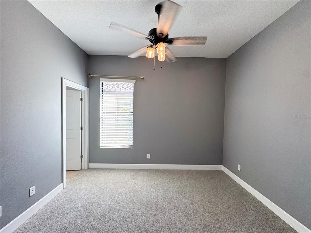 12822 Del Corso Loop Bradenton, FL 34211 - Photo 22 of 58 a view of room with a ceiling fan and window
