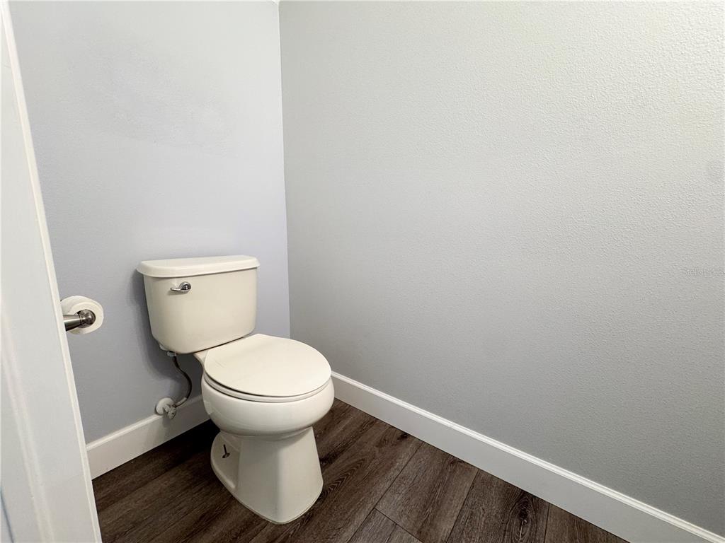 12822 Del Corso Loop Bradenton, FL 34211 - Photo 30 of 58 a white toilet sitting in a bathroom